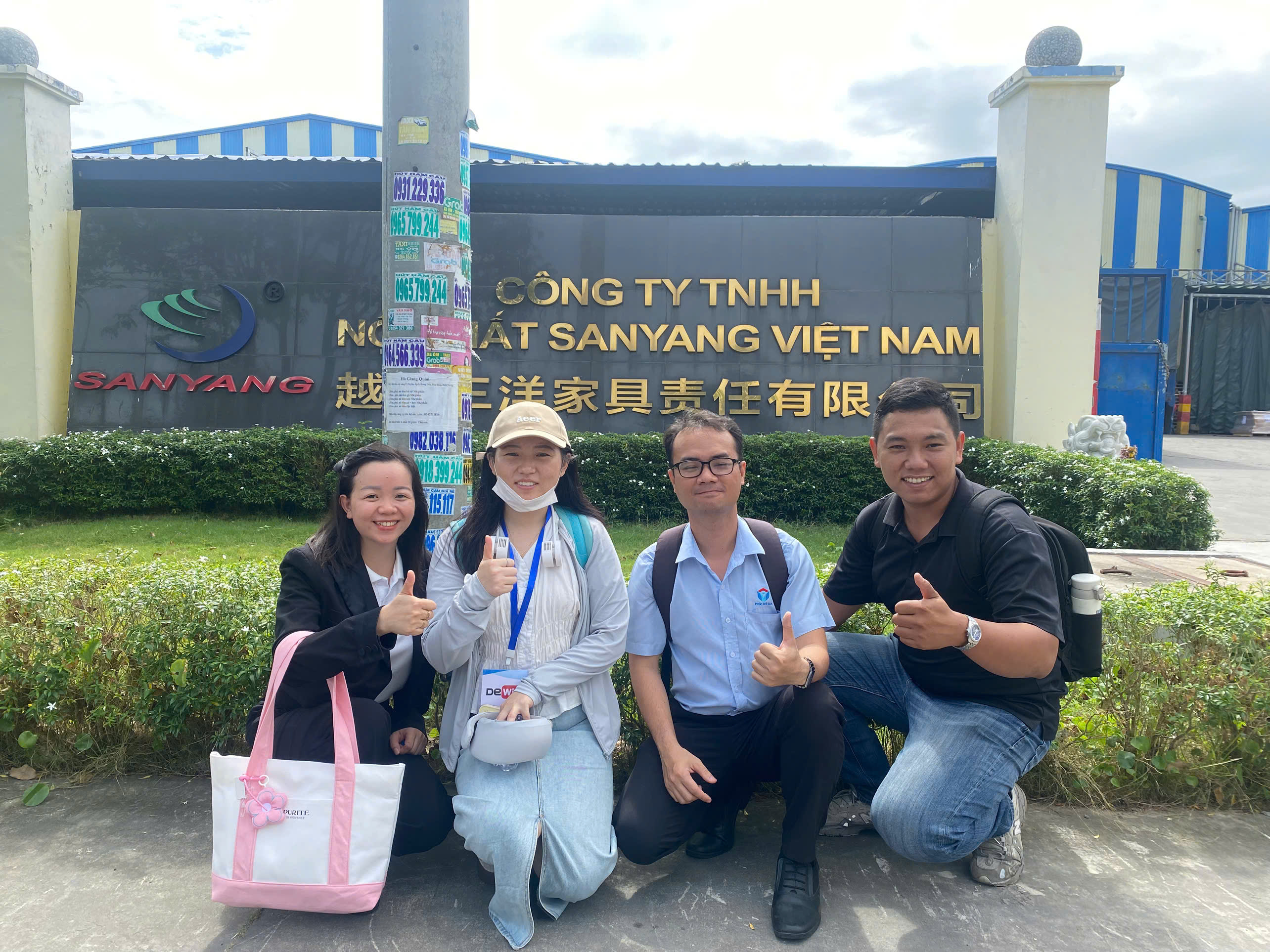 Photo with factory gate.jpg